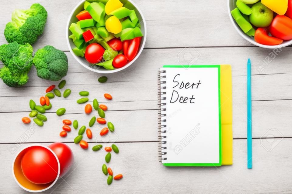 concept diet, slimming plan with vegetables top view mock up