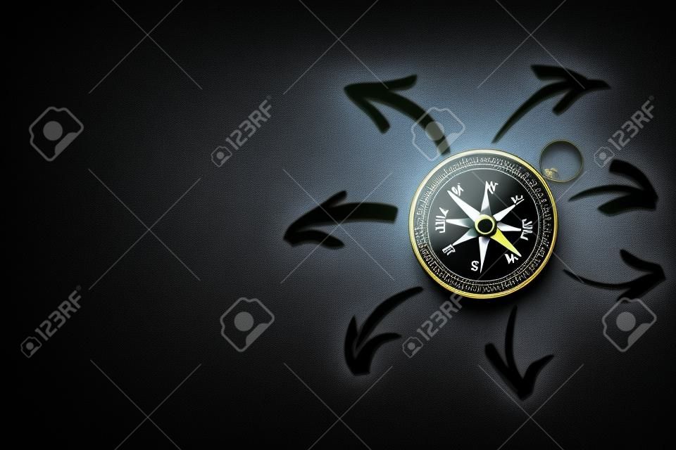 compass on dark background with arrows