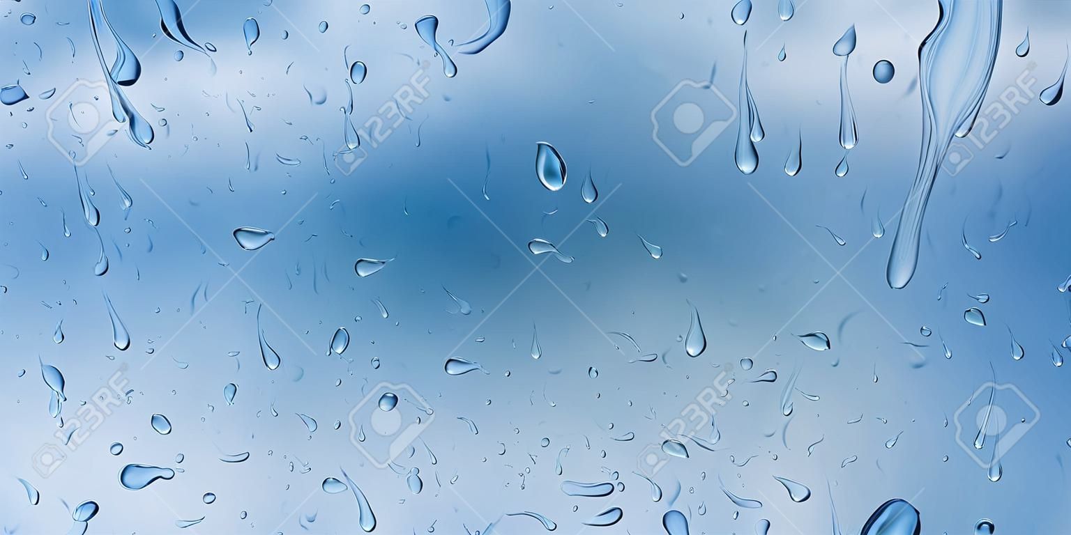Background with drops and streaks of water in light blue colors, flowing down the surface