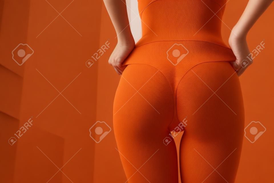 Crop woman with perfect buttocks