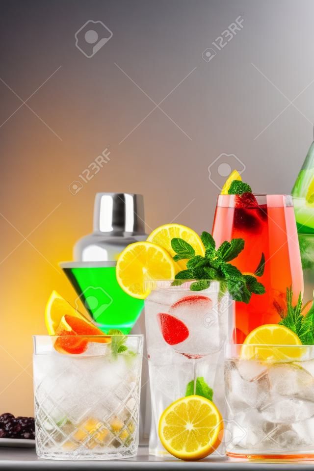Popular trendy cocktails set: aperol spritz, negroni, mojito, gin tonic and cosmopolitan on gray bar counter background