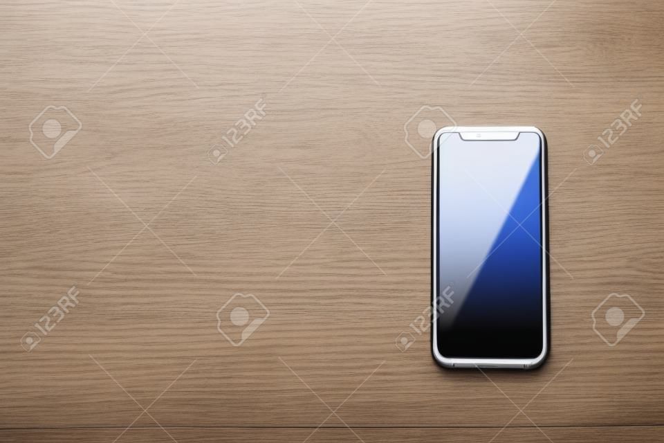 Smartphone on white wooden table