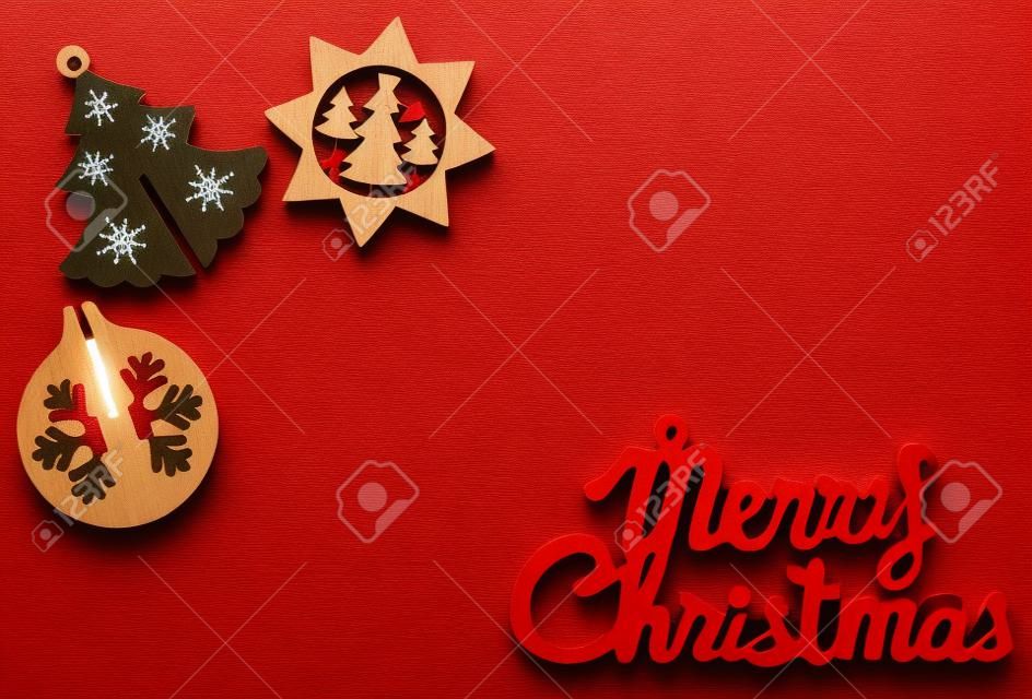 Christmas wooden figures on red brilliant background