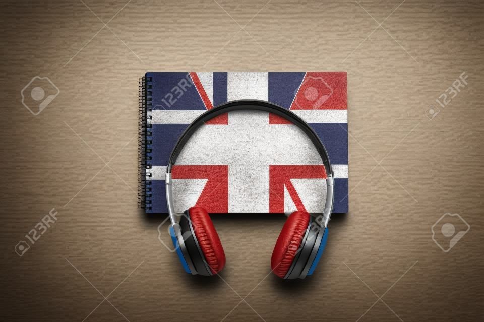 English courses concept. British flag on notebook and headphones