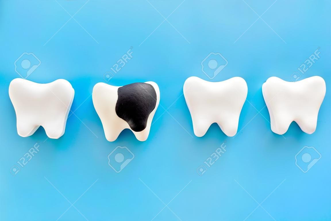 Dental health concept. Teeth models with caries or plaque