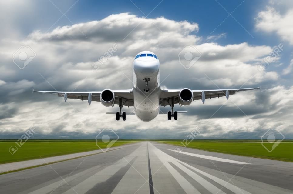 Airplane aircraft flying departure landing speed motion on a runway in the good weather with cumulus clouds sky day