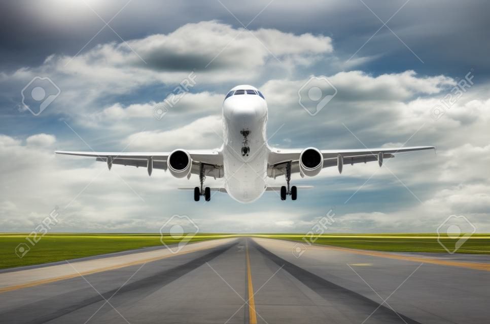 Airplane aircraft flying departure landing speed motion on a runway in the good weather with cumulus clouds sky day