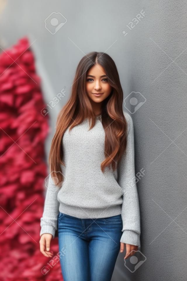 Beautiful young girl posing on the street