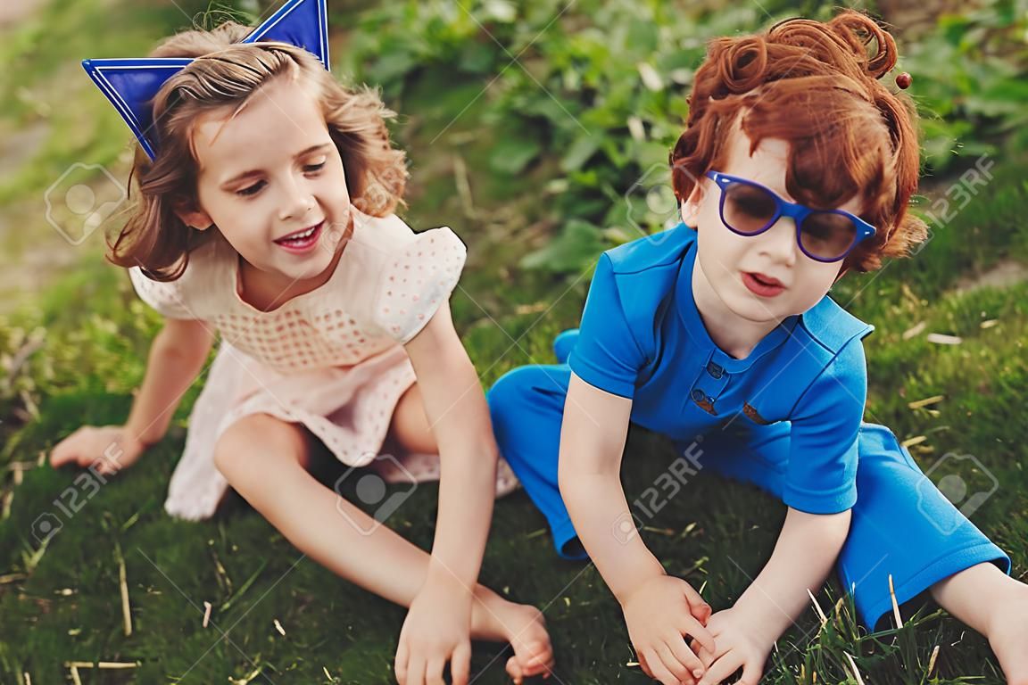 Cute stylish children in summer park