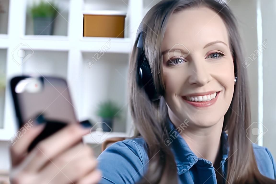 Happy White Woman Smiling, Using Phone, Having Video Call, Video Chatting  At Home Or In The Office. Фотография, картинки, изображения и  сток-фотография без роялти. Image 165862144