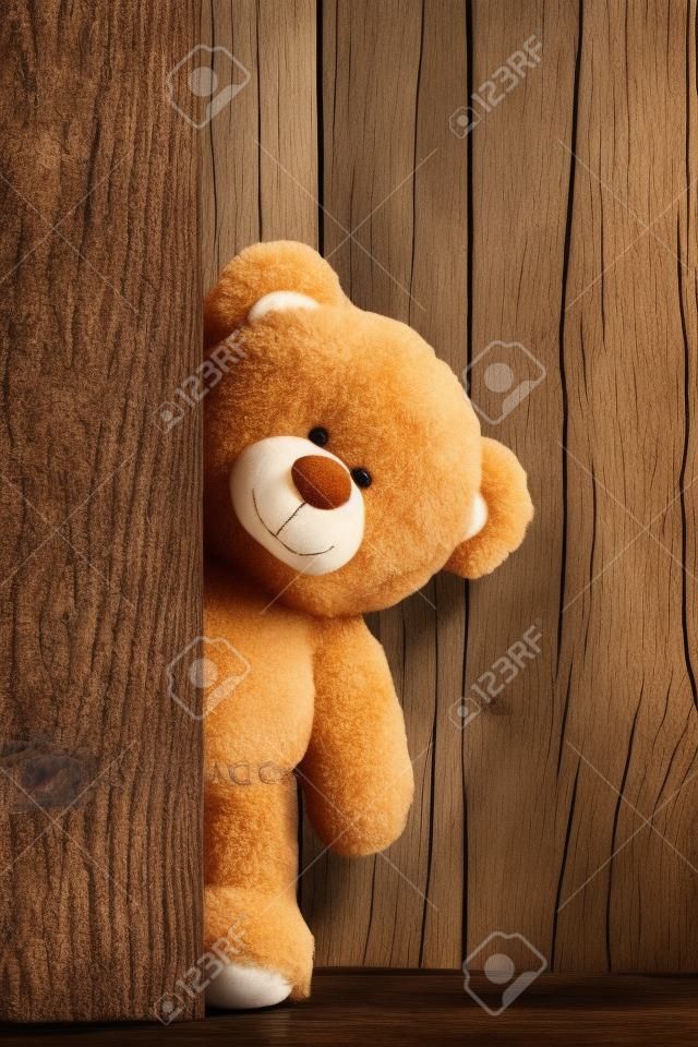 Leuke teddyberen met oude houten achtergrond