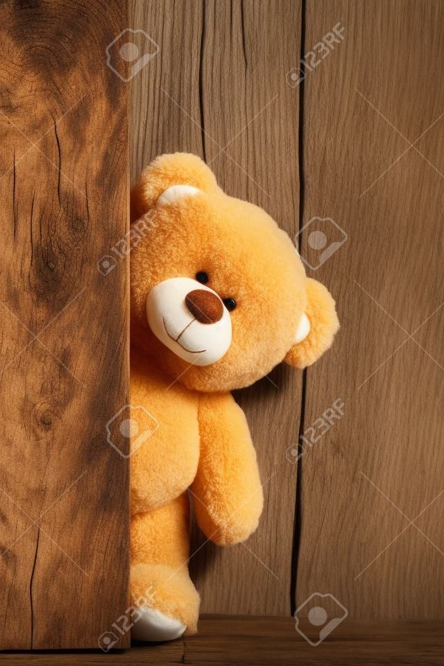Cute teddy bears with old wood background