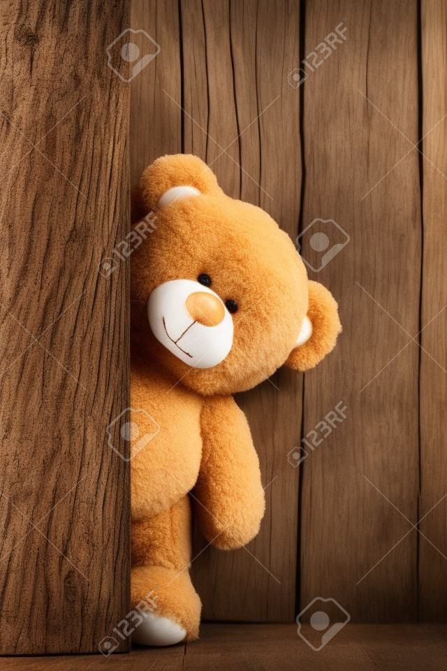 Cute teddy bears with old wood background