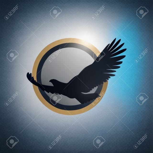 Simple and unique flying bird or eagle with moon or sun behind image graphic icon logo design abstract concept vector stock. Can be used as symbol related to animal or freedom