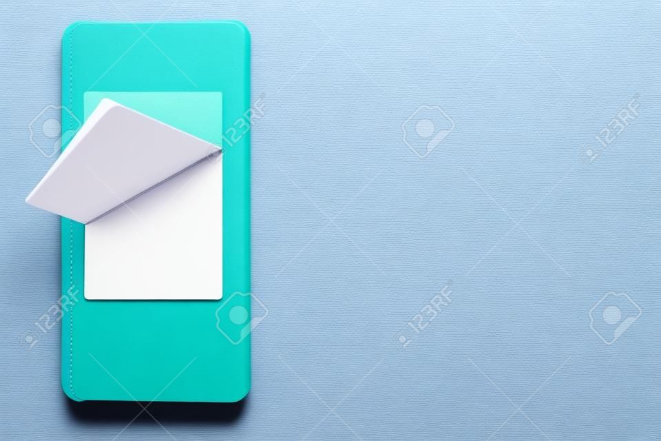 notebook for records in the phone to save information in memory, on a colored background
