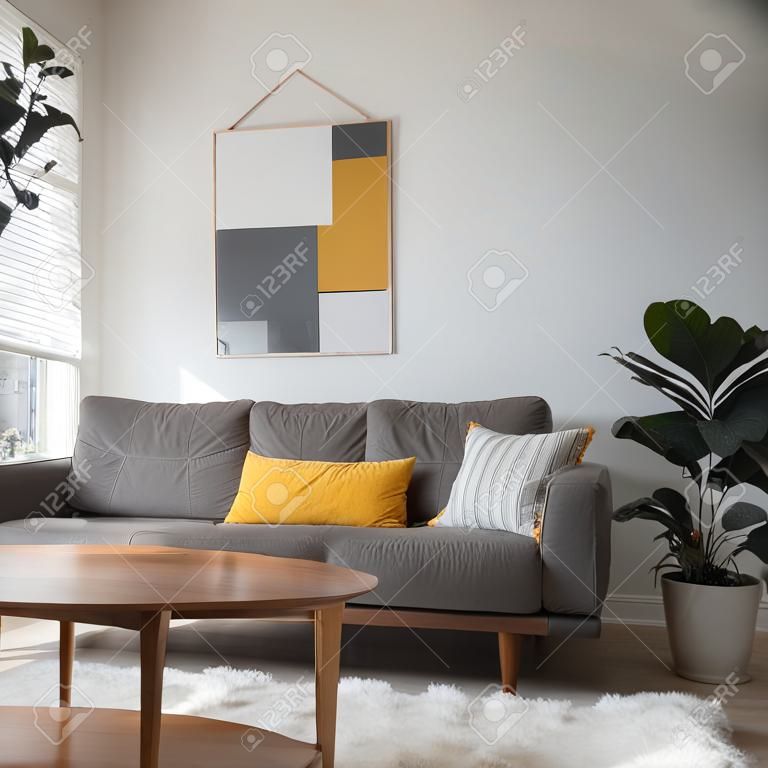 Coffee table in front of grey couch in scandinavian living room