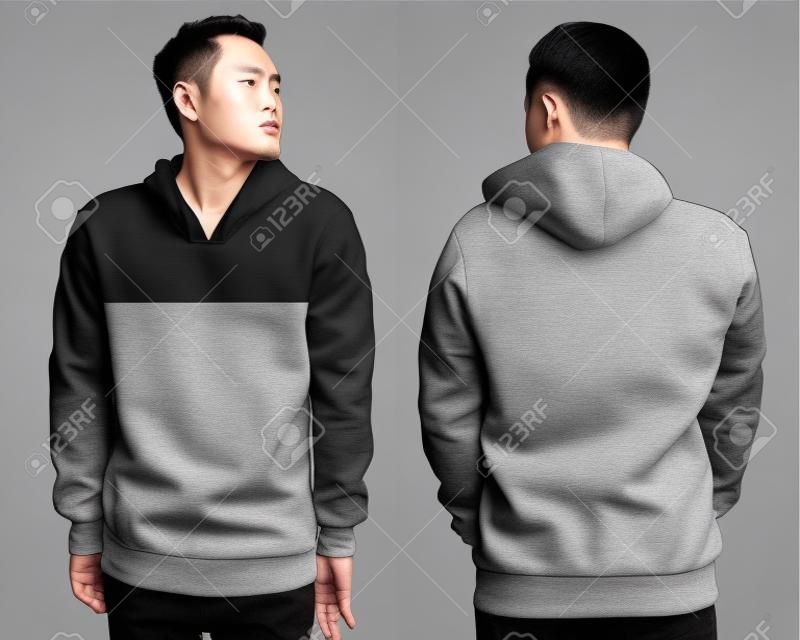 Boş takım örtüsü taklidi, ön ve arka görünüm, gri izole edilmiştir. Asyali erkek modeli düz siyah hoodie mockup takiyor. Hoody tasarım sunumu. Baskı için atlama kablosu. Boş giysiler ter gömlek süveter