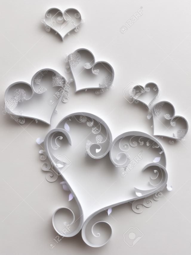 Декоративные формы сердца в сером цвете сделан цветочные элементы на белом фоне на День Святого Валентина.