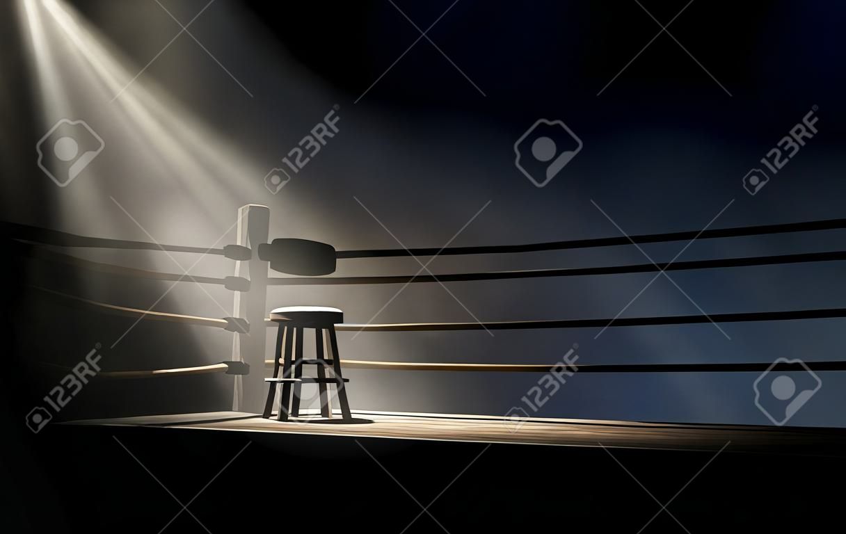 Uma visão dramática do canto de um antigo anel de boxe vintage com um banco vazio iluminado por um único holofote em um fundo escuro isolado