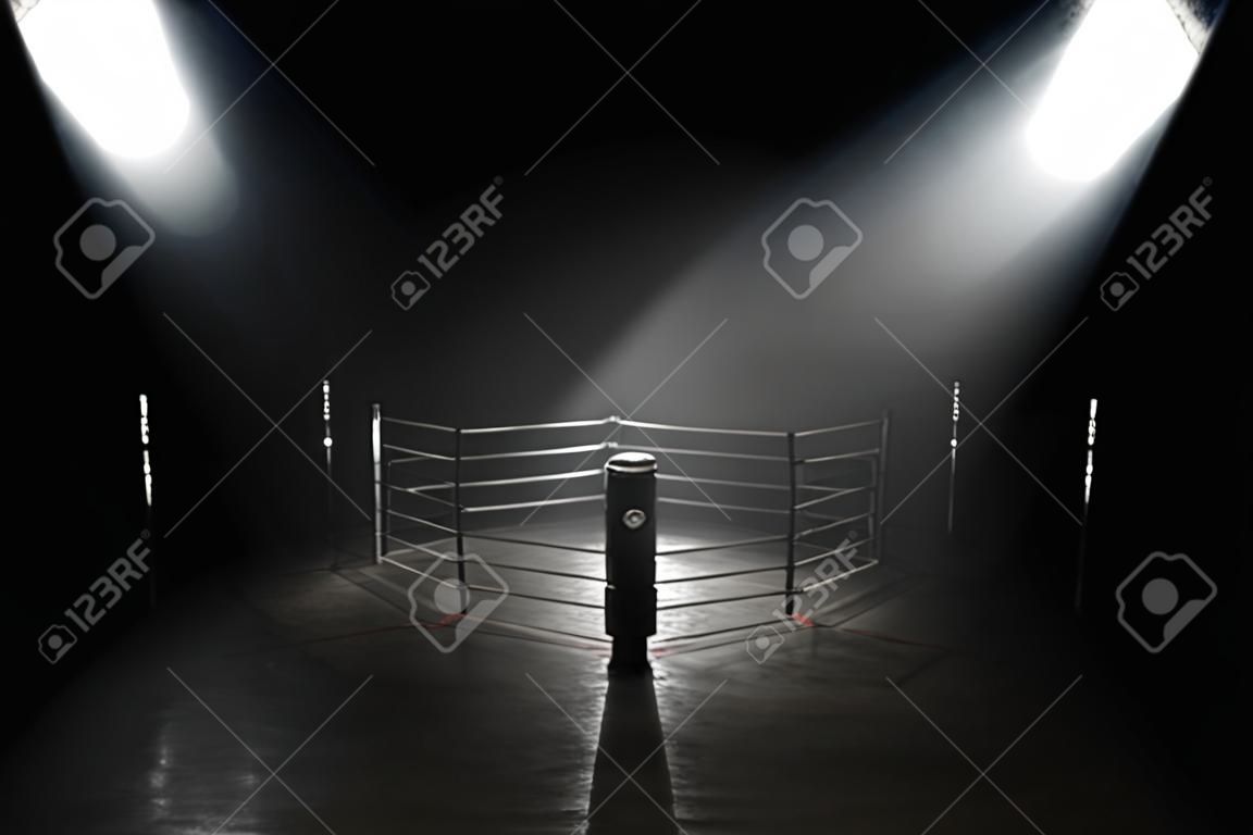 A concept showing a boxing ring on a reflective concrete pitch with illuminated red lines backlit by a single honeycomb spotlight - 3D render