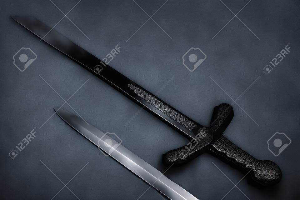 Knightly swords on a gray background