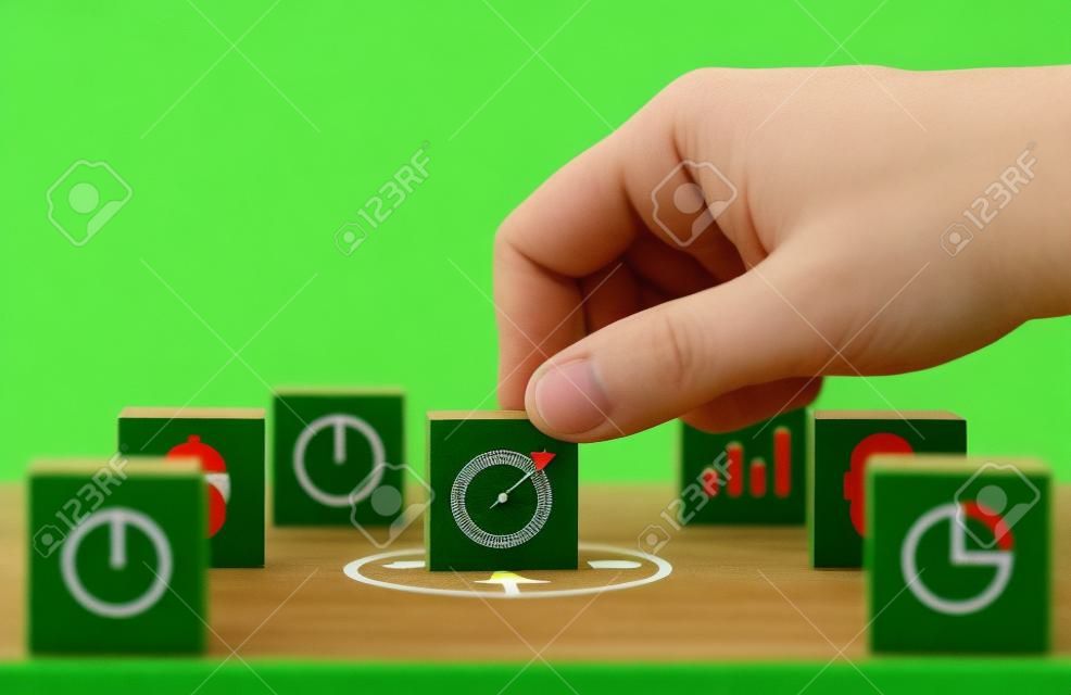 Hand putting target board with arrow on green background to setup objective target and investment goal.