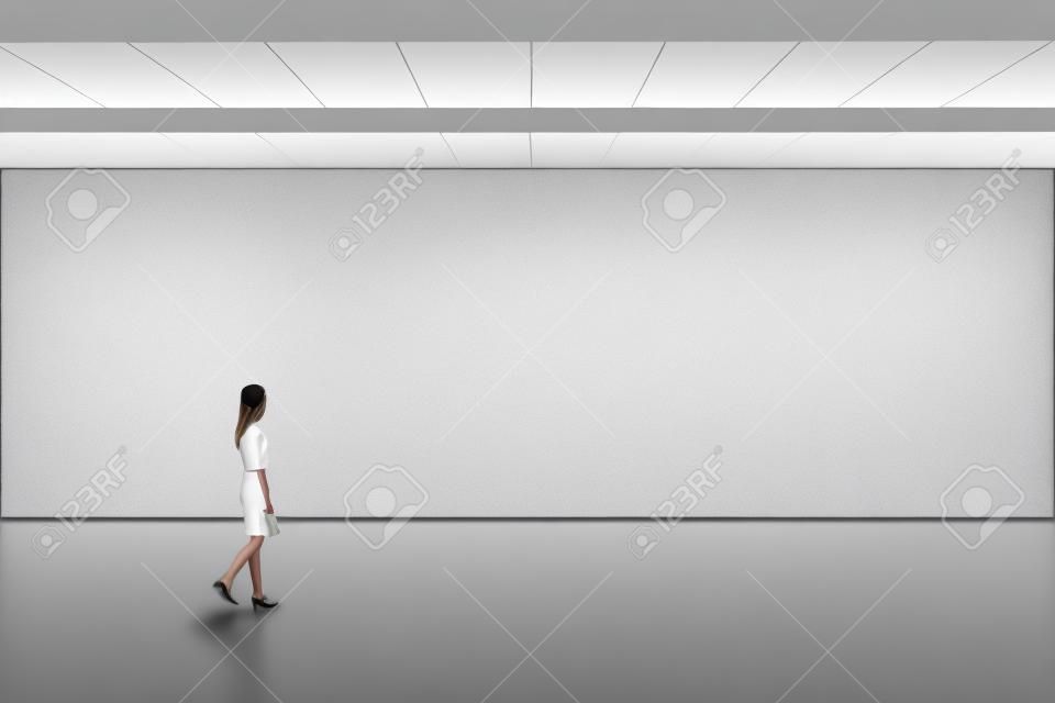 Empty big hall wall mockup. Woman walk in museum gallery with blank wall.