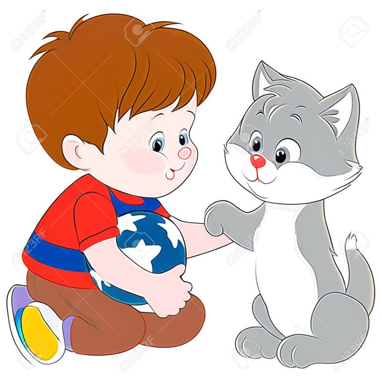 boy plays with his gray kitten