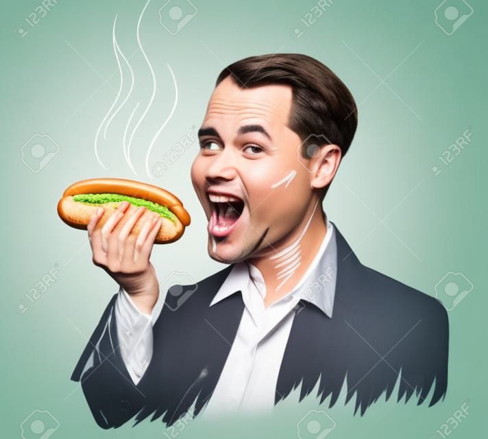 Szczęśliwy mężczyzna jedzący hot doga na białym tle