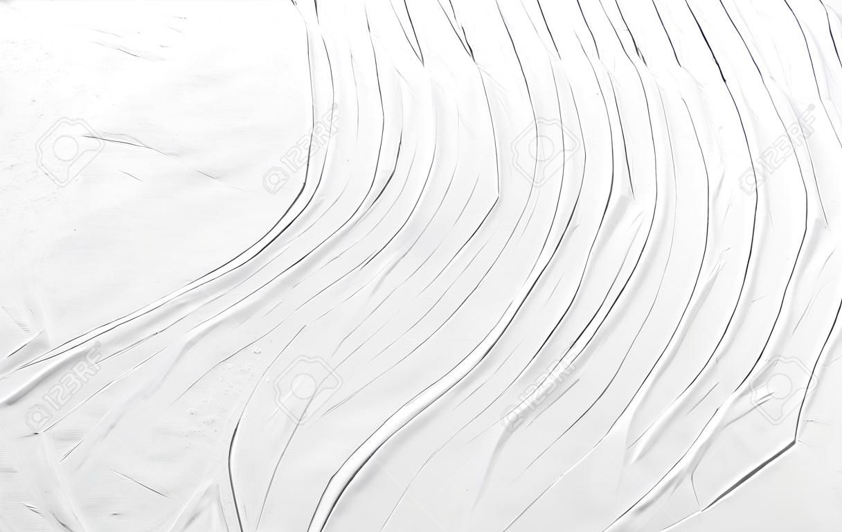 Sfondo astratto bianco con una superficie ruvida di linee ondulate. Struttura di gesso, cemento