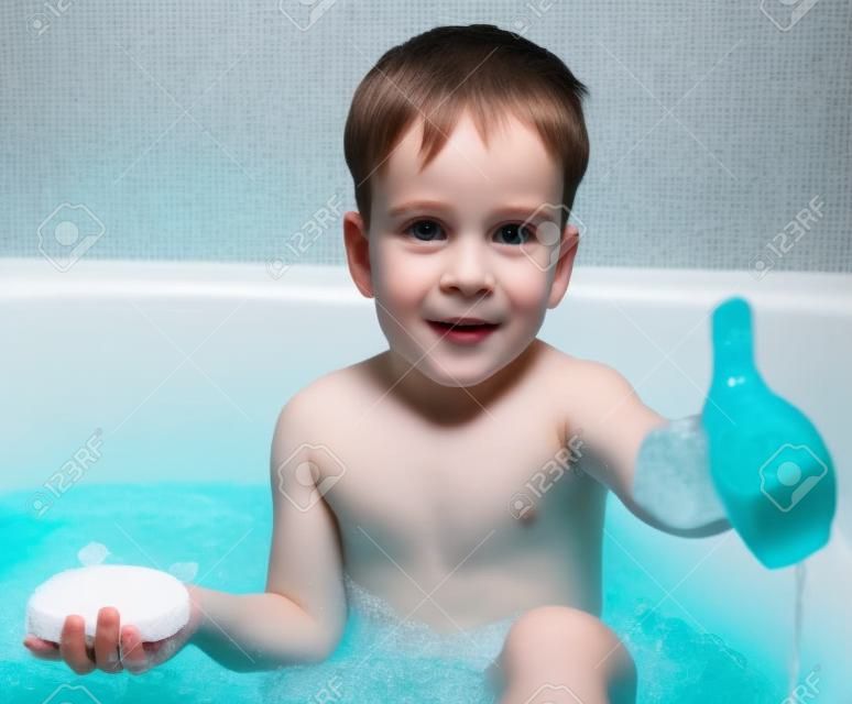 Young boy in bath with soap