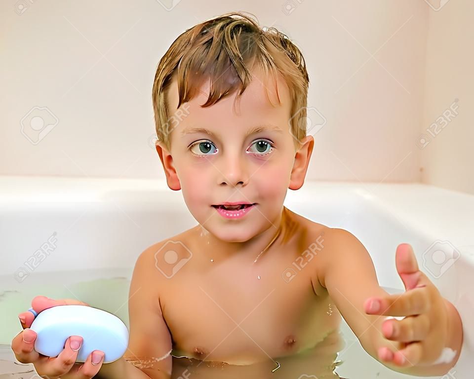 Young boy in bath with soap