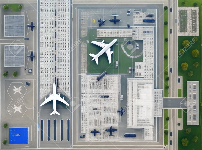 punto Overhead di vista aeroporto con tutti gli edifici, aerei, veicoli e pista dell'aeroporto