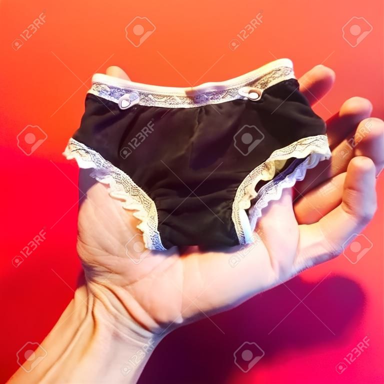 Hands holding underwear