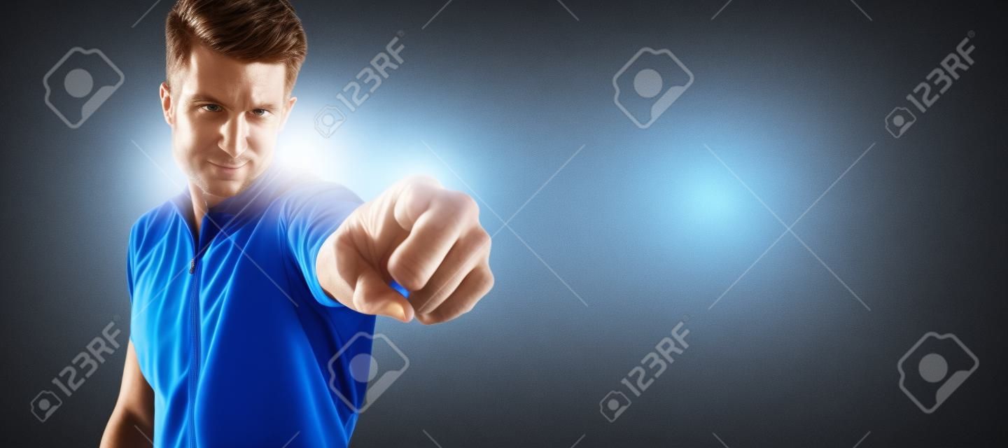 Sport man pointing his finger at you