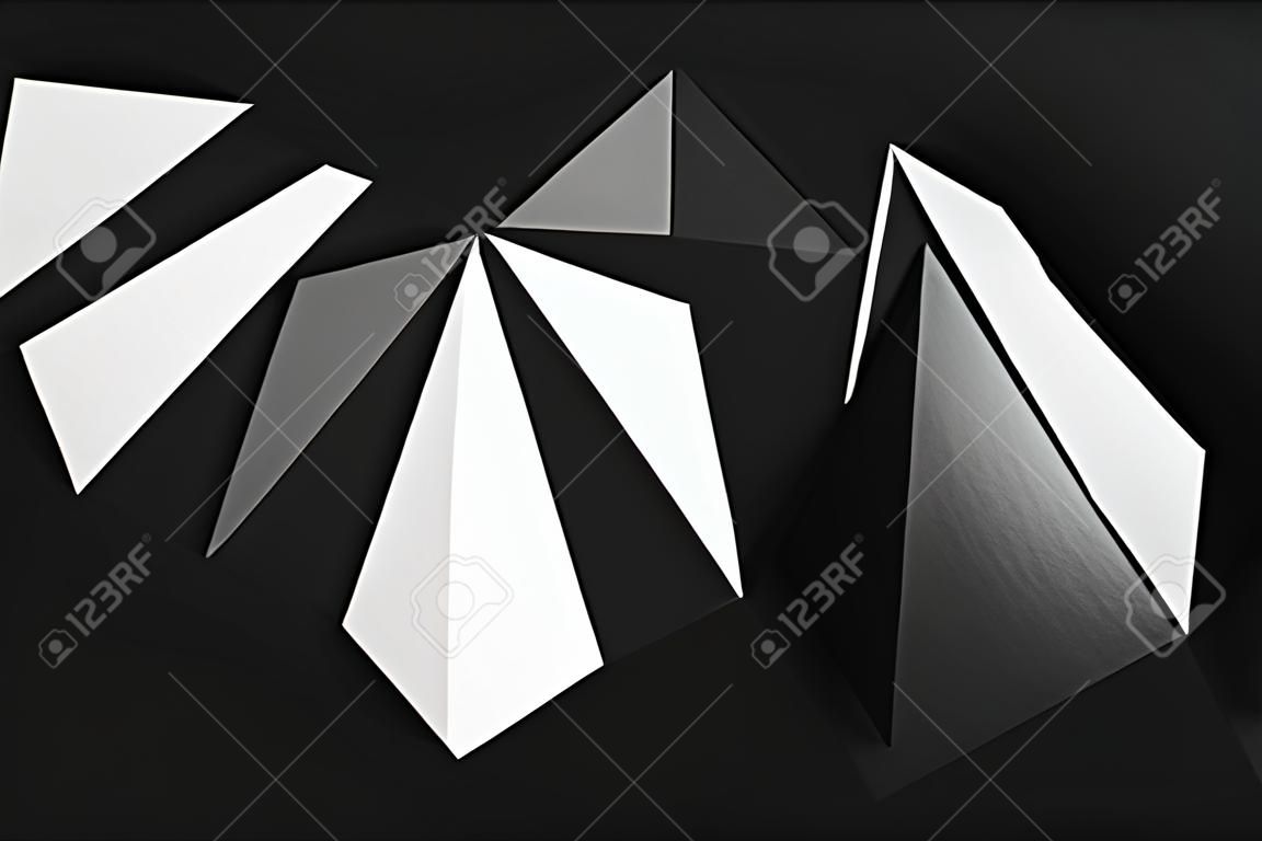 Formas geométricas triangulares de papel para fondo oscuro, abstracto