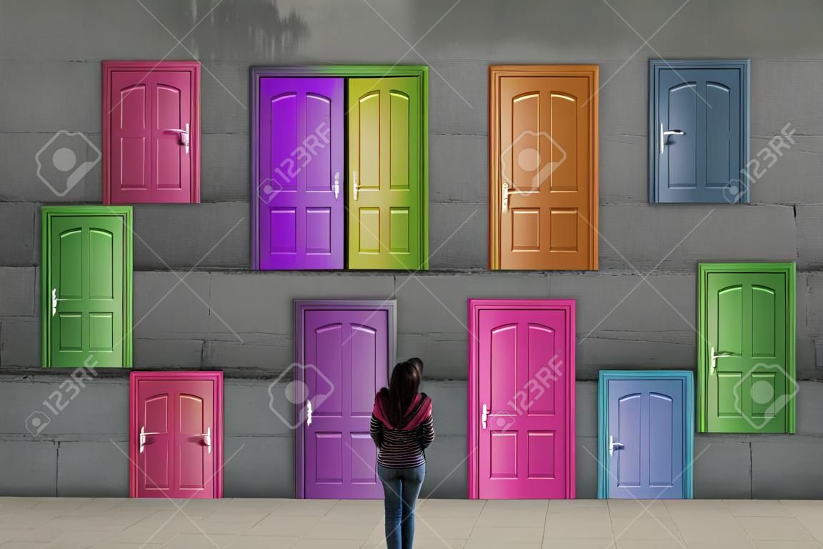 Multiple doors with different colors on a wall .  Difficult decision concept . This is a 3d render illustration . 