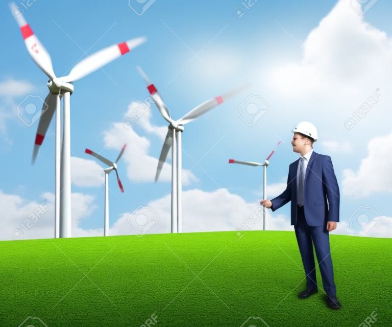 Concept of businessman that plans a wind turbine project