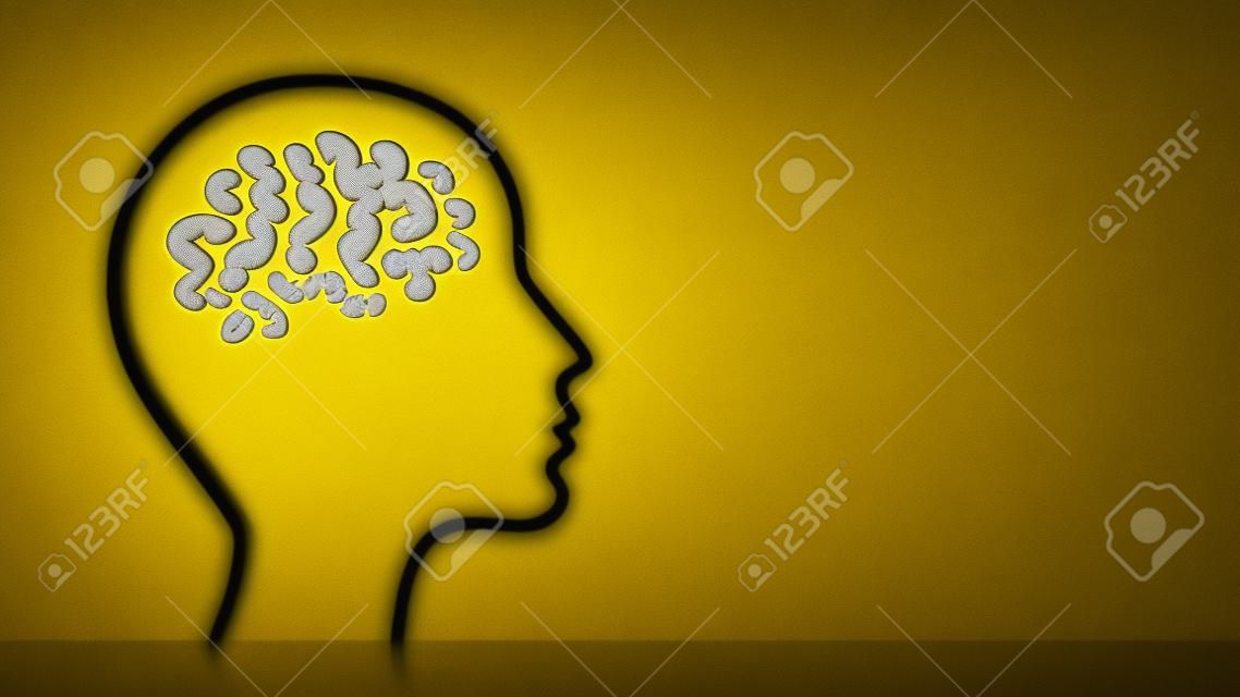 Großer Kopf mit Fragezeichen im Gehirn auf Gelb