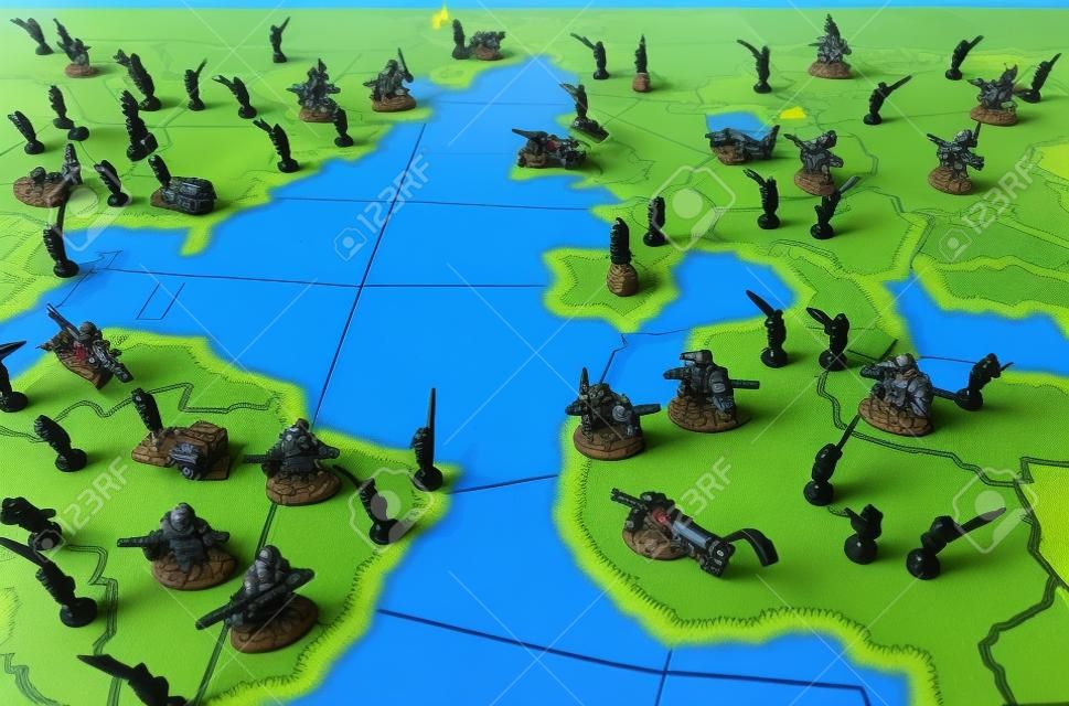 World domination boardgame with troop figurines. Symbol for world politics, warfare and tensions.