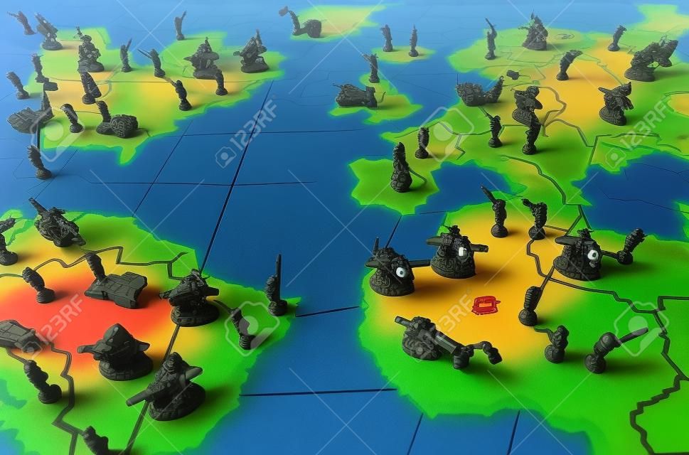World domination boardgame with troop figurines. Symbol for world politics, warfare and tensions.
