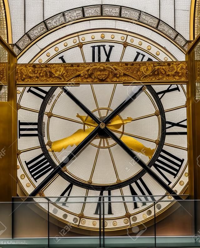Extremely large, clock visible from the outside of the Musee d'Orsay Museum in Paris, France