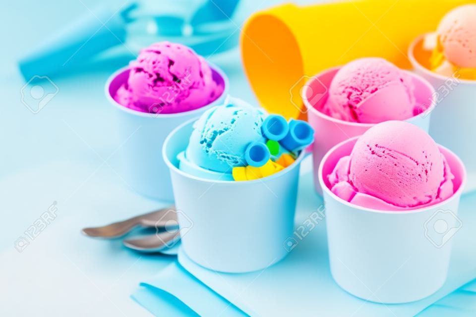 Selection of colorful ice cream scoops in paper cones