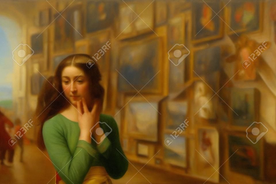 The girl in the art gallery looks at works of art and admires the works of great masters of art.