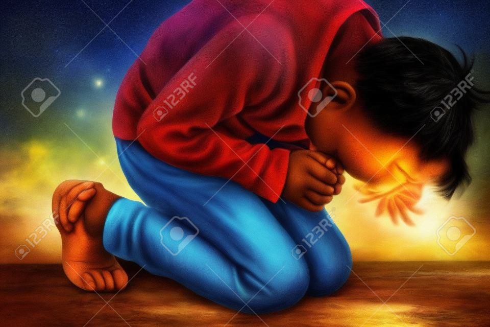 The boy bowed in prayer before God. The child is kneeling in the prayer of repentance before the Supreme Creator