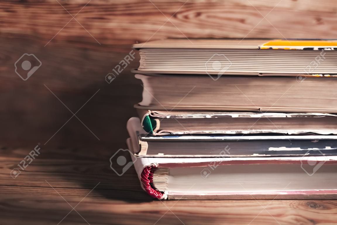 Books on wooden desk. Education