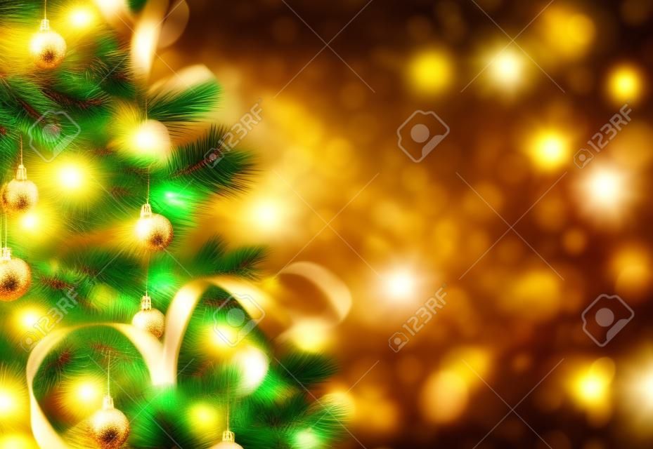 Gold Christmas background of defocused lights with decorated tree
