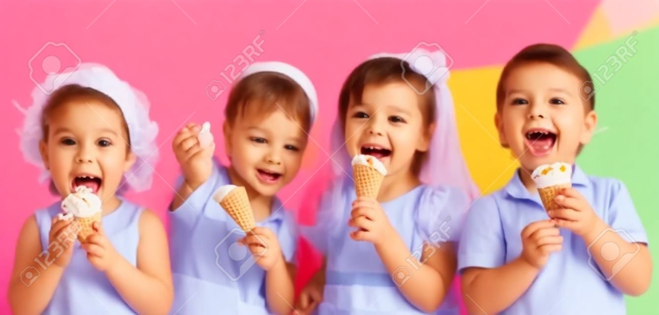 funny children group eating ice cream on party