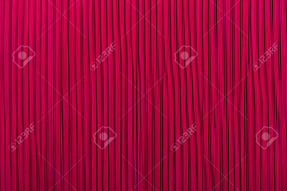 Decoratieve achtergrond rode kleur, gestreepte textuur. Wallpaper. Art Design