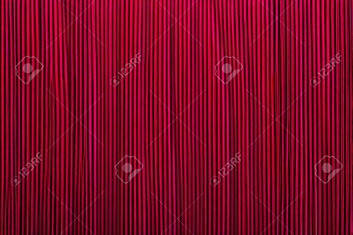 Decoratieve achtergrond rode kleur, gestreepte textuur. Wallpaper. Art Design